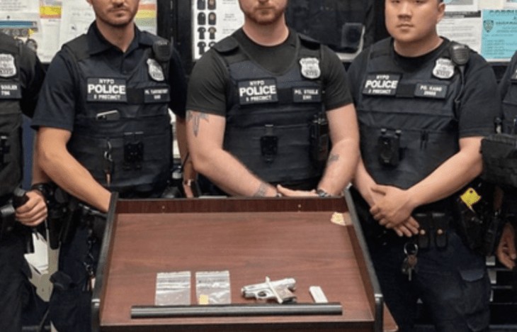 NYPD officers pose with impressive cache of firearm